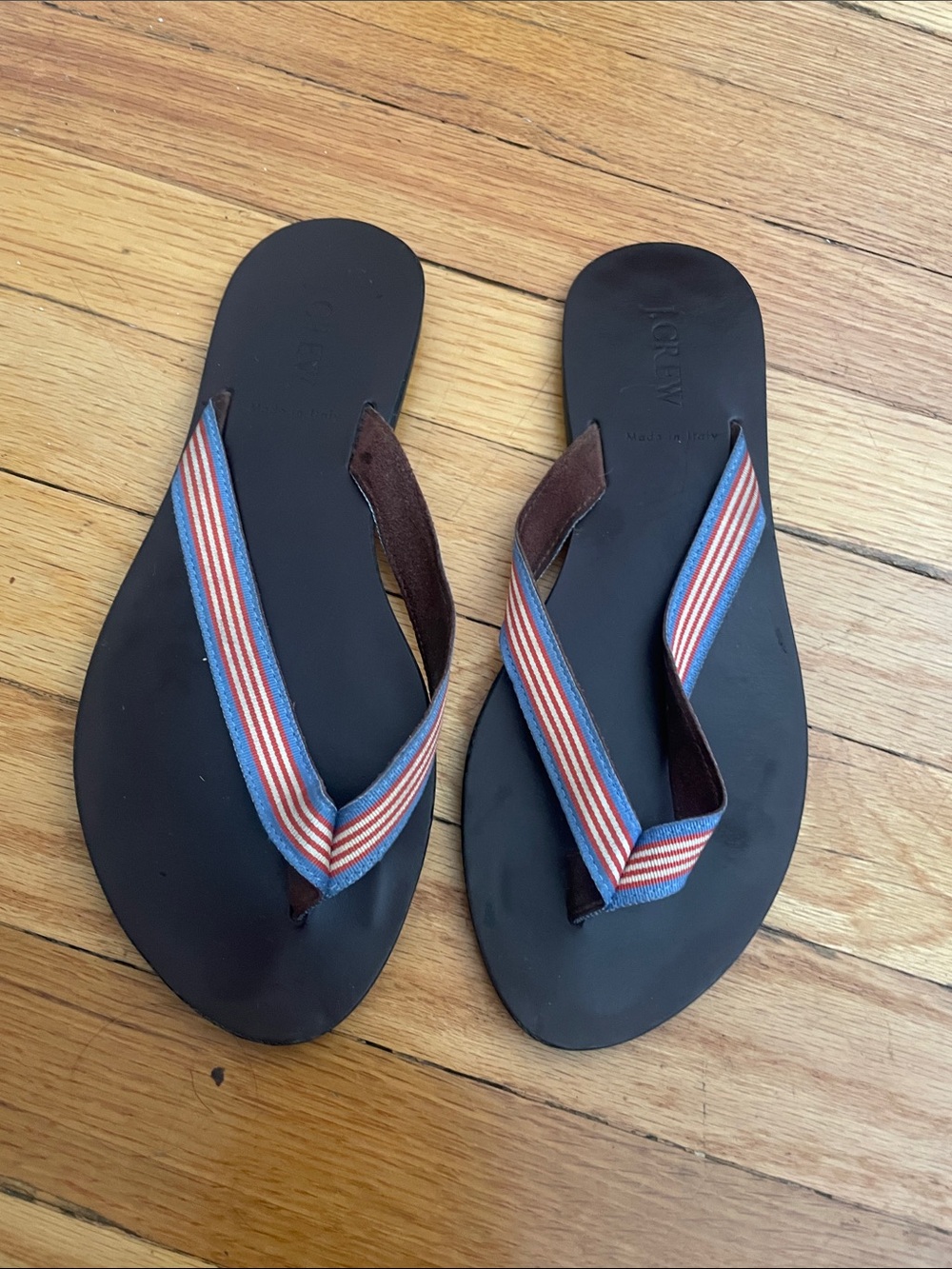 J. Crew Black Leather Flip Flops with Blue and Red Striped Webbing. Like new.
